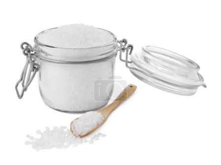 Photo for Glass jar and wooden spoon of natural sea salt isolated on white - Royalty Free Image