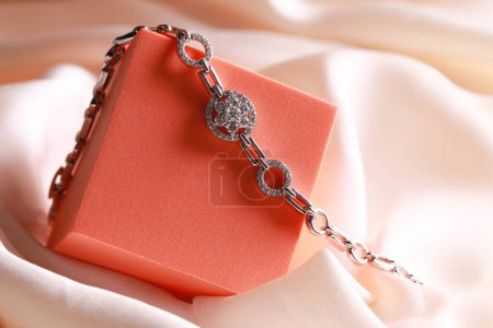 Elegant jewelry. Stylish presentation of luxury bracelet on podium, closeup