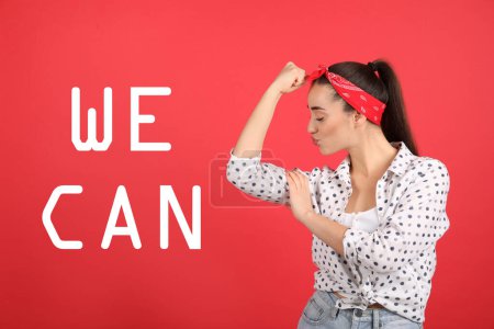 Foto de 8 March greeting card. Phrase We Can and strong young woman as symbol of girl power on red background - Imagen libre de derechos