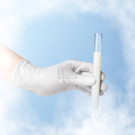 Photo for Cryopreservation. Laboratory assistant holding test tube with sperm on light blue background, closeup. Frost effect - Royalty Free Image