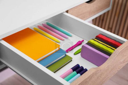 Téléchargez les photos : Office supplies in open desk drawer indoors, closeup - en image libre de droit