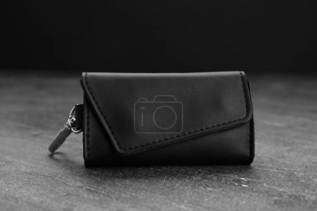 Photo for Stylish leather keys holder on grey table, closeup - Royalty Free Image