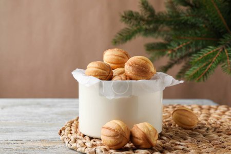 Téléchargez les photos : Delicious nut shaped cookies on blue rustic table - en image libre de droit