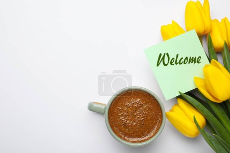 Téléchargez les photos : Welcome card, beautiful yellow tulips and cup of aromatic coffee on white background, flat lay - en image libre de droit