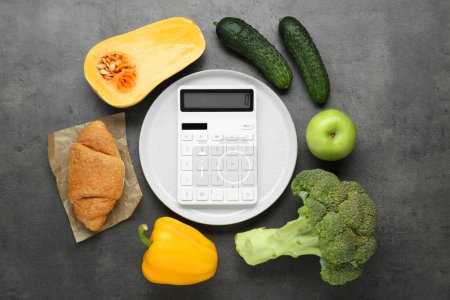 Photo for Calculator and food products on dark grey table, flat lay. Weight loss concept - Royalty Free Image