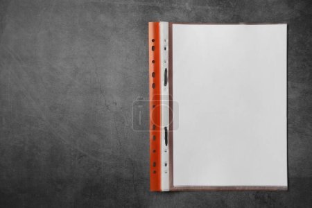 Photo for File folder with punched pockets on grey table, top view. Space for text - Royalty Free Image