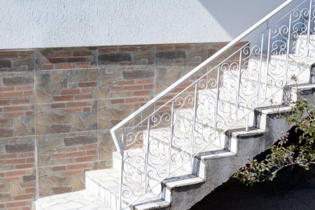 Photo for Beautiful stairs with metal railings near house outdoors - Royalty Free Image