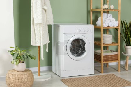 Photo for Stylish laundry room with washing machine. Interior design - Royalty Free Image