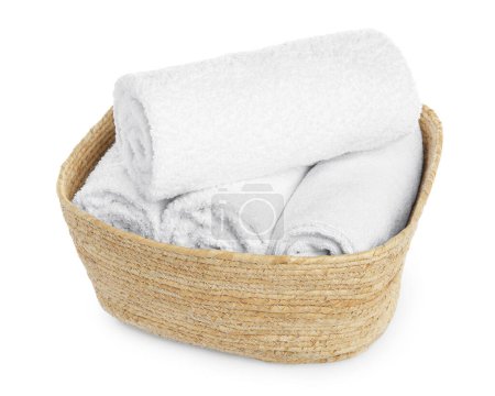 Foto de Wicker laundry basket with clean towels isolated on white - Imagen libre de derechos