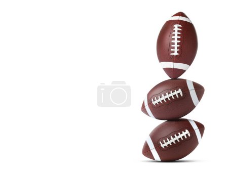 Téléchargez les photos : Empilement de ballons de football américains sur fond blanc. Espace pour le texte - en image libre de droit