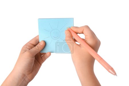 Photo for Child erasing drawing of sun with erasable pen against white background, closeup - Royalty Free Image
