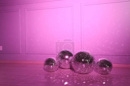 Photo for Shiny disco balls indoors, toned in pink. Space for text - Royalty Free Image