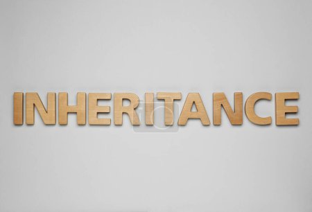 Photo for Word Inheritance made with wooden letters on light background, flat lay - Royalty Free Image