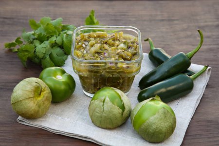 Photo for Tasty salsa sauce and ingredients on wooden table - Royalty Free Image