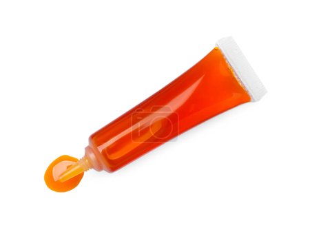 Téléchargez les photos : Tube avec colorant alimentaire orange isolé sur blanc, vue de dessus - en image libre de droit