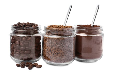 Jars with different types of coffee on white background