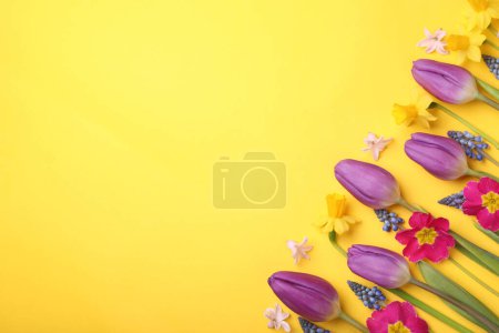 Photo for Beautiful different flowers on yellow background, flat lay. Space for text - Royalty Free Image