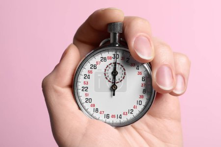 Photo for Woman holding vintage timer on pink background, closeup - Royalty Free Image