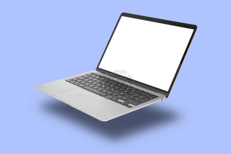 Photo for Modern laptop flying on light slate blue background - Royalty Free Image