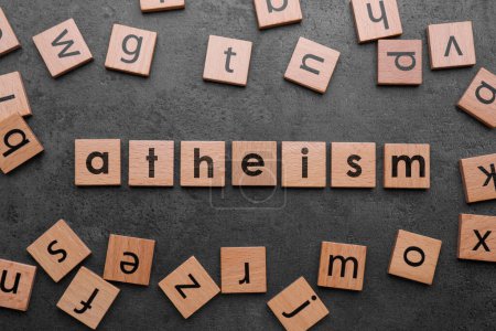 Photo for Word Atheism made of wooden squares with letters on grey textured table, flat lay - Royalty Free Image