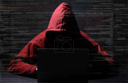 Téléchargez les photos : Cyber attaque. Pirate anonyme travaillant avec un ordinateur portable sur fond noir. Différents codes numériques et icônes autour de lui - en image libre de droit