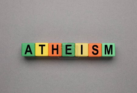Photo for Word Atheism made of wooden cubes with letters on grey table, top view - Royalty Free Image