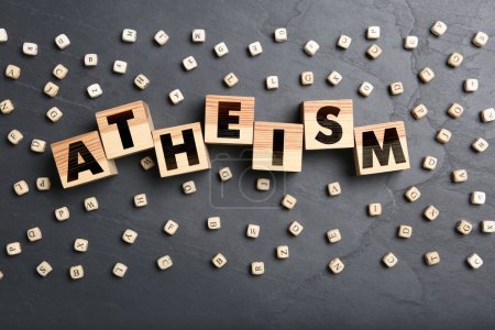 Photo for Word Atheism made of wooden cubes with letters on grey table, flat lay - Royalty Free Image