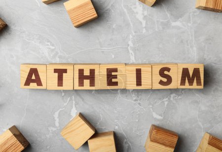 Photo for Word Atheism made of wooden cubes with letters on grey marble table, flat lay - Royalty Free Image