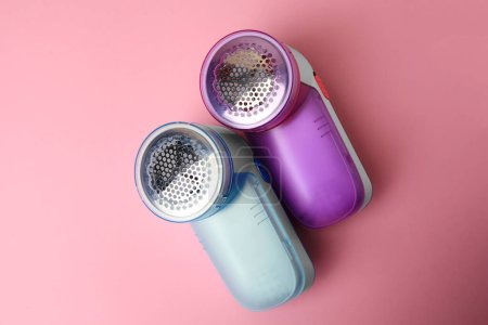 Photo for Modern fabric shavers on pink background, flat lay - Royalty Free Image