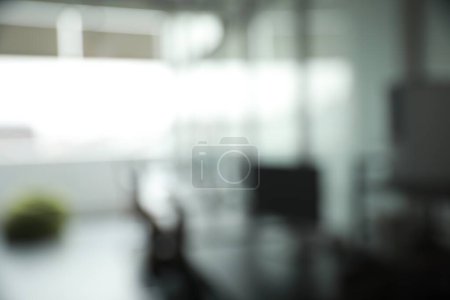Photo for Blurred view of cozy workspaces with tables and chairs in office - Royalty Free Image