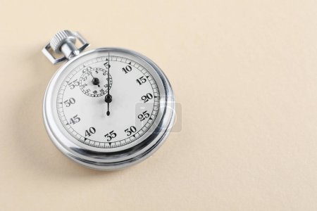 Photo for Vintage timer on beige background, space for text. Measuring tool - Royalty Free Image