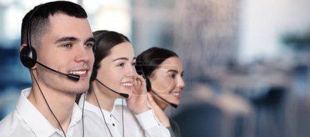 Photo for Hotline operators with headsets in office, space for text. Banner design - Royalty Free Image