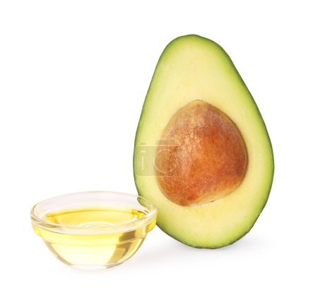 Photo for Cooking oil and half of fresh avocado isolated on white - Royalty Free Image