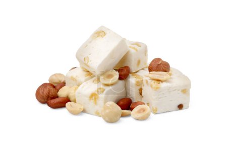 Pieces of delicious nougat and nuts on white background