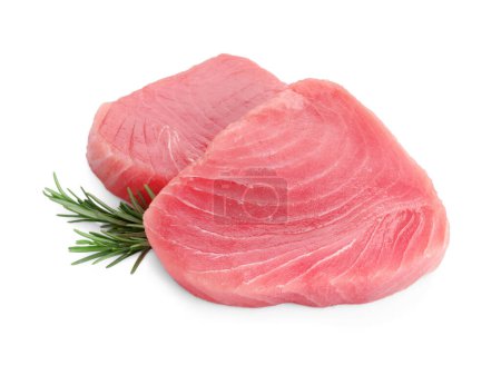 Raw tuna fillets with rosemary on white background