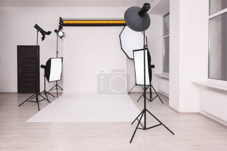 Stylish photo studio with modern professional equipment