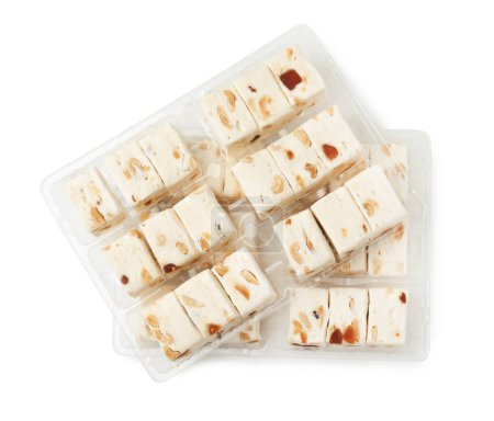 Photo for Plastic containers with pieces of nougat on white background, top view - Royalty Free Image