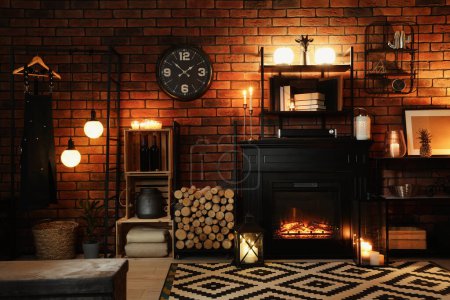 Stylish living room with beautiful fireplace and different decor at night. Interior design