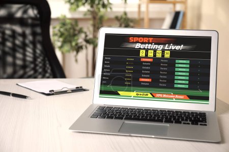 Betting on sports. Laptop with bookmaker site on screen
