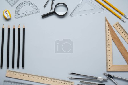 Photo for Flat lay composition with different rulers and compasses on light grey background. Space for text - Royalty Free Image