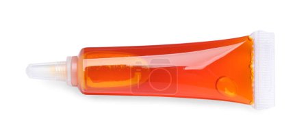 Téléchargez les photos : Tube avec colorant alimentaire orange isolé sur blanc, vue de dessus - en image libre de droit