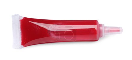 Téléchargez les photos : Tube avec colorant alimentaire rouge isolé sur blanc, vue de dessus - en image libre de droit