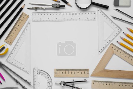 Photo for Flat lay composition with different rulers and compass on white background - Royalty Free Image