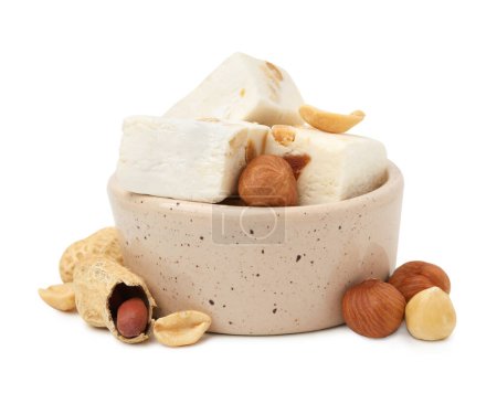 Photo for Bowl with pieces of delicious nougat and nuts on white background - Royalty Free Image