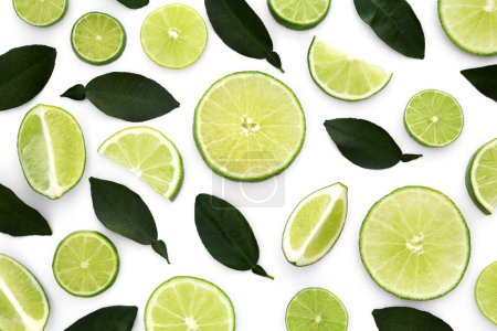 Photo for Fresh cut limes with leaves on white background, flat lay - Royalty Free Image