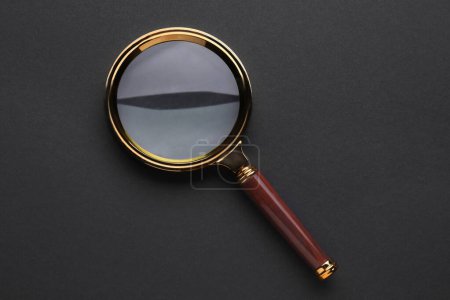 Photo for Magnifying glass on dark background, top view - Royalty Free Image