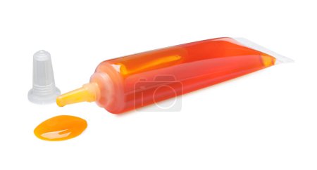 Téléchargez les photos : Tube avec colorant alimentaire orange isolé sur blanc - en image libre de droit