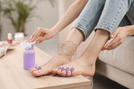 Photo for Woman preparing toenails for pedicure at home, closeup - Royalty Free Image