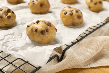 Photo for Uncooked chocolate chip cookies on table, closeup - Royalty Free Image