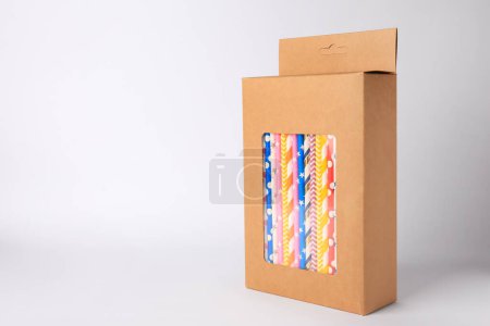 Photo for Box with many paper drinking straws on light grey background. Space for text - Royalty Free Image